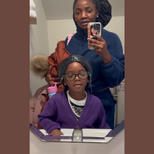 Picture of Simi with Daughter Taking a Bathroom mirror selfie