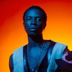 Firstklaz, Nigerian Afrobeats and Fuji singer, portrait with blue and orange lighting