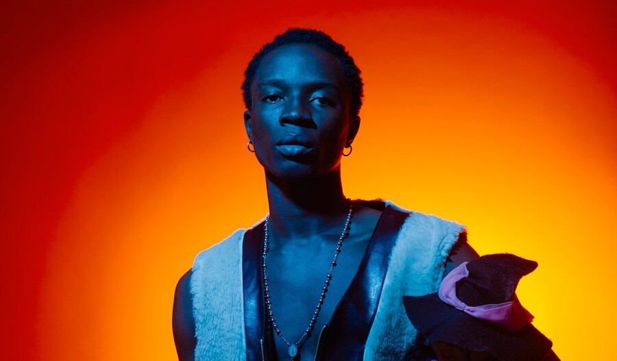 Firstklaz, Nigerian Afrobeats and Fuji singer, portrait with blue and orange lighting